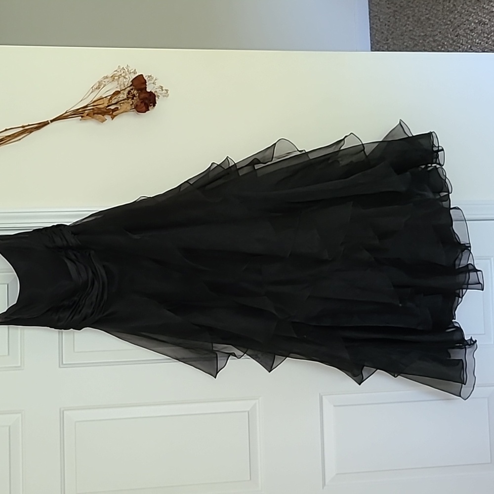 Formal black ruffle dress.